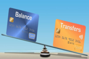 Credit cards balancing on a board