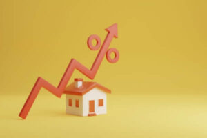 House icon and red arrow pointing up on yellow background representing increasing mortgage.