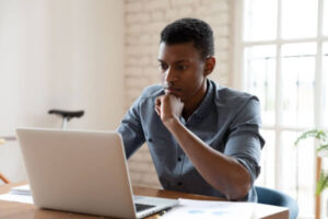 Concerned student loan borrower reading news about DOGE