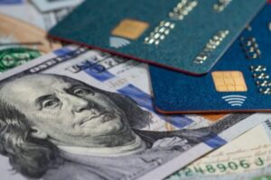 Credit cards and dollars in cash close up.